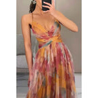 Amara – Elegant maxi dress made of floral chiffon, with delicate spaghetti straps and a sophisticated cut-out