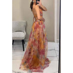Amara – Elegant maxi dress made of floral chiffon, with delicate spaghetti straps and a sophisticated cut-out
