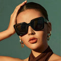 Celine – Black oversized sunglasses with angular cat-eye design