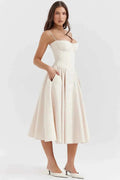 Clara – Midi dress with corset top, spaghetti straps, and flared skirt