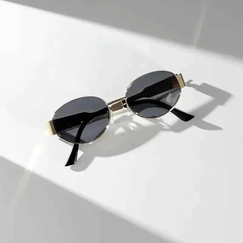 Elina – Oval women's sunglasses with metal frame and dark lenses