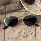 Elina – Oval women's sunglasses with metal frame and dark lenses