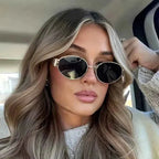 Elina – Oval women's sunglasses with metal frame and dark lenses