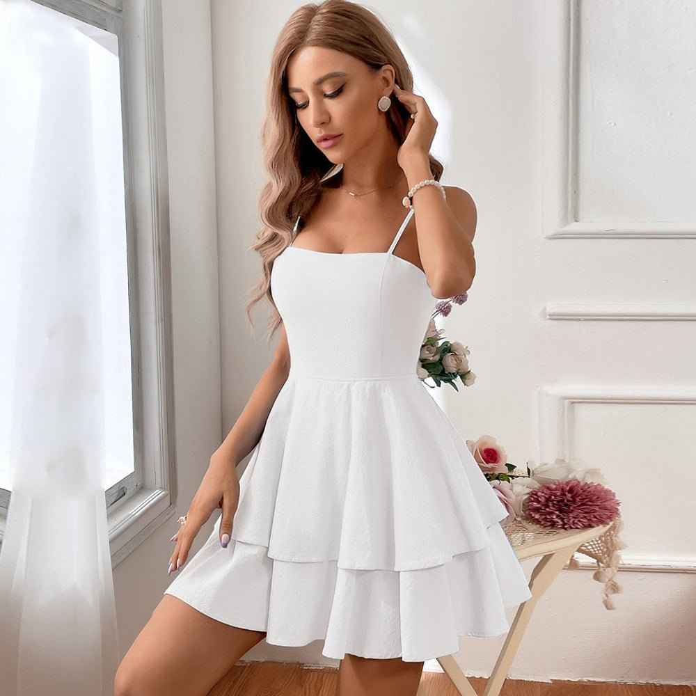 nola – tiered ruffle mini dress with spaghetti straps & back bow